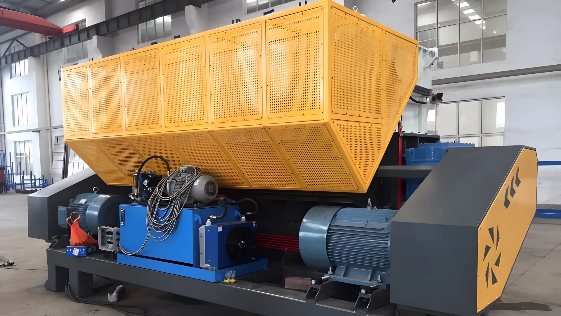 Large industrial shredder machine in a factory.