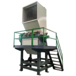 Industrial heavy-duty Granulator machine with safety railing and ladder for material processing.