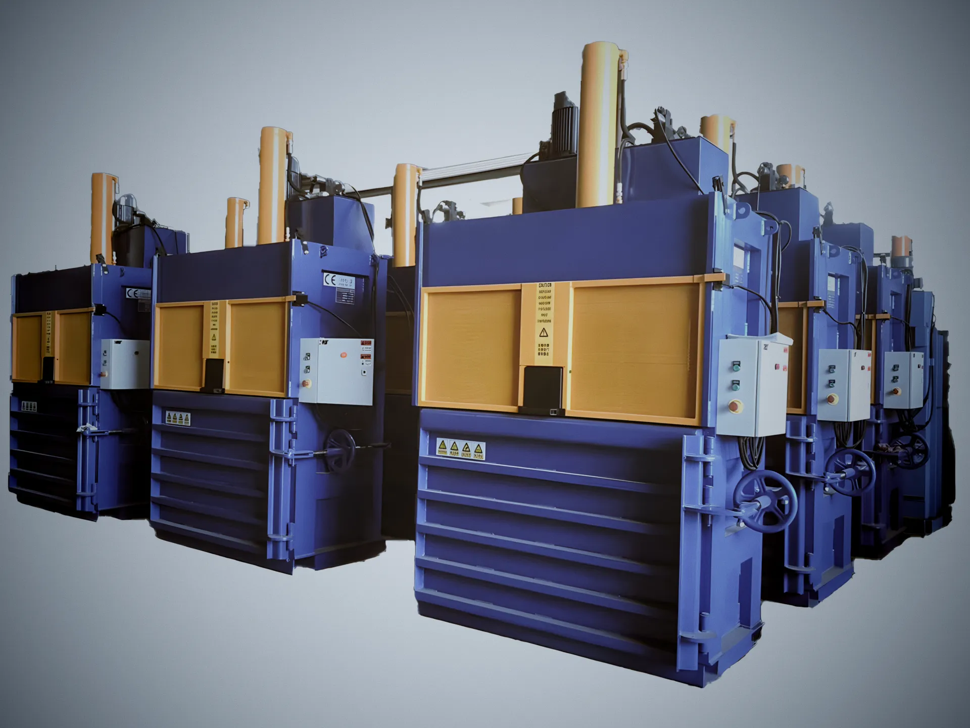 Vertical baling machines for compressing recyclable materials into compact bales